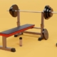 A weight bench with a barbell and weights positioned on either side, ready for strength training exercises.
