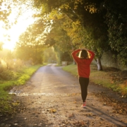 A woman strolls along a road