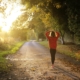 A woman strolls along a road