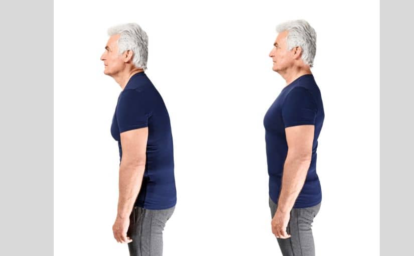 The back view of an older man wearing a blue shirt, standing with a neutral posture.