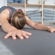 person doing static stretch for the back