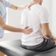 person getting spinal adjustment because of body pain and fever