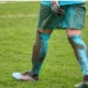 football player walking on grass