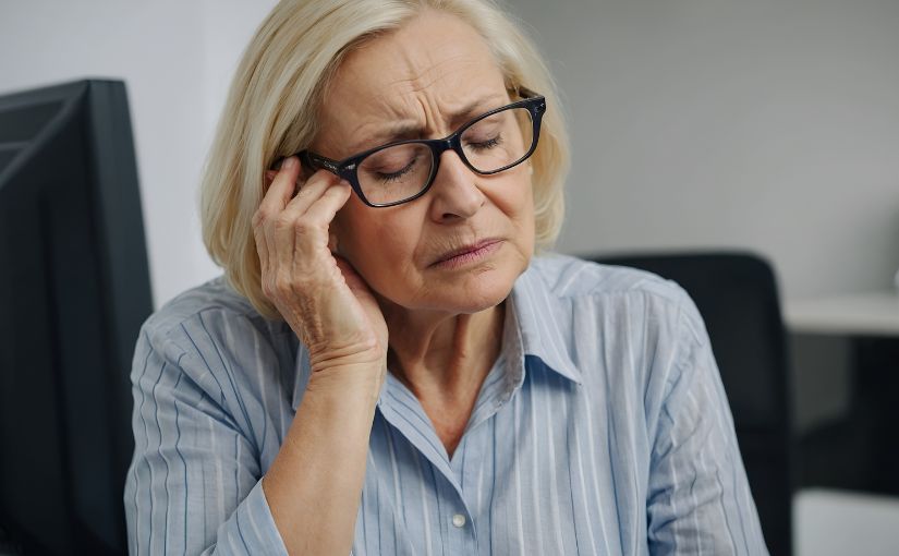Person touching eye area because of discomfort