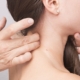 Chiropractor examining a woman’s neck and cervical spine for pain relief and alignment.