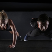 two persons doing workout on the floor