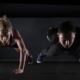 two persons doing workout on the floor