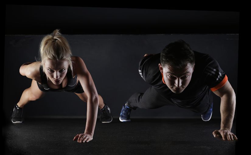 two persons doing workout on the floor